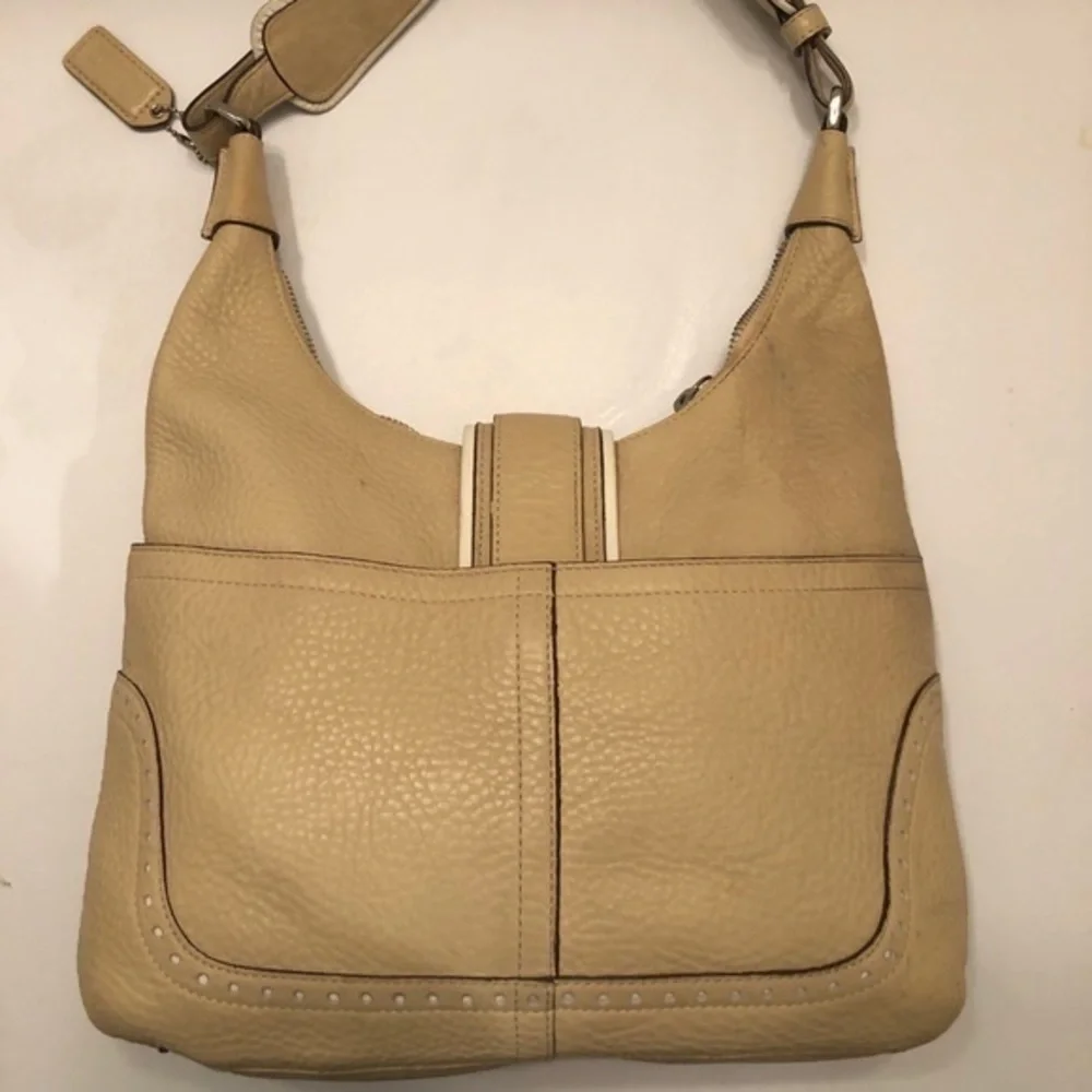Coach cream pebbled leather perforated hobo bag